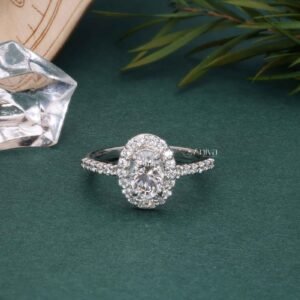 Oval Opulence: 1.0 Carat Oval Shaped Solitaire Diamond Engagement Ring with Micropave Halo Side Stones
