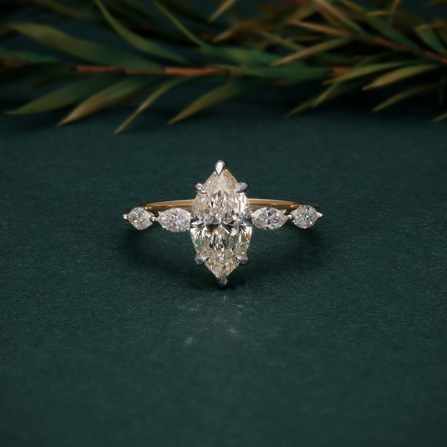 Elegant 18K Yellow Gold Marquise Solitaire Ring with Pear-Shaped Side Stones | IGI Certified